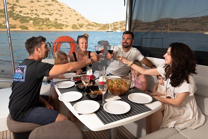 Ag. Nikolaos: Catamaran Trip with Sushi, Drinks, & Water Toys - Mirabello Bay swim stops: snorkeling, SUP, sea scooter, and play time