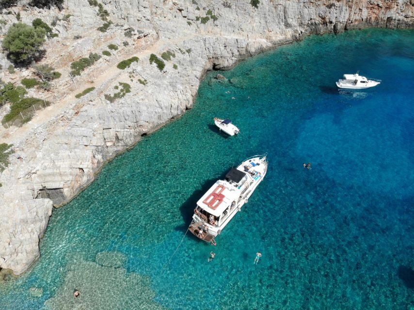 Chania: Menies Beach & Chironisia Bay Cruise with Snorkeling - Menies Beach: Ancient Diktynna Views Above and WWII Finds Below