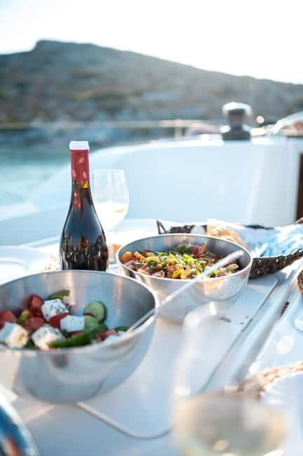 Heraklion: Dia Island Sunset Boat Tour with Dinner - Dia Island at Saint George Bay: Swim, Snorkel, Fish, and SUP