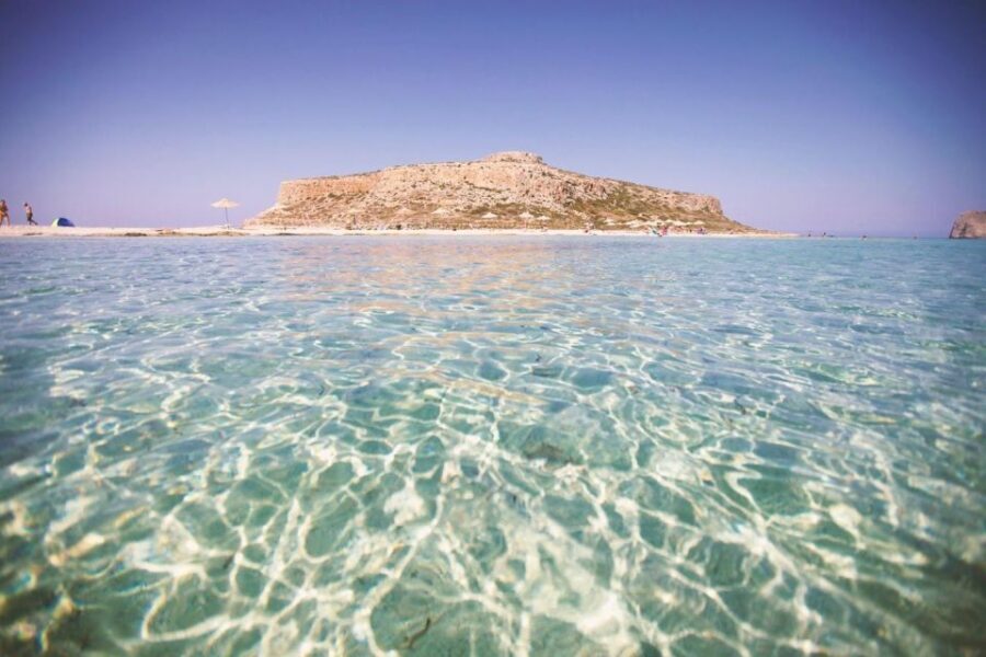 Heraklion: Gramvousa Island Day Trip & Balos Beach - Balos Lagoon and Balos Bay: wind, turquoise water, and slippery rocks